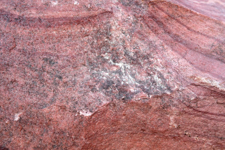 Close-up of a vivid rock surface showing natural patterns and colors.の写真素材