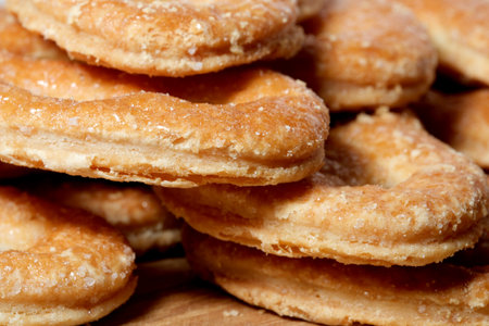 Golden-brown pastries arranged neatly, showing a tempting texture.の写真素材