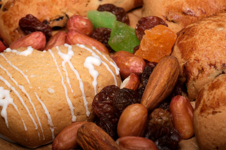 Colorful sweets and nuts create a tempting display of festive delights.の写真素材