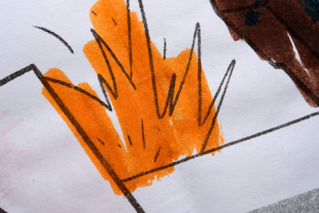 Bright orange flames burst from a bold drawing, showing creativity.