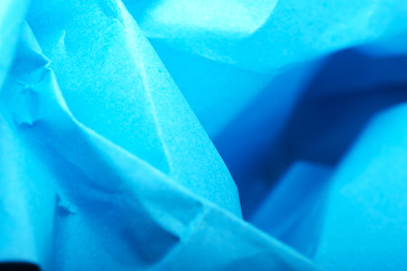 Unique shades of blue paper intertwined, creating an artistic texture.の写真素材