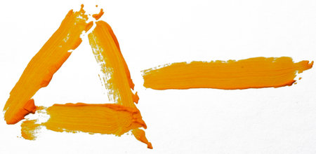 Bright orange strokes create unique shapes, highlighting creativity and expression.の写真素材