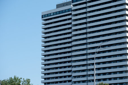 Tall structure stands proudly against a bright sky, showing bold architecture.の写真素材