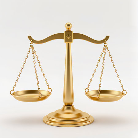 Shiny golden balance scales rest on a neutral background, representing equity and law.の素材