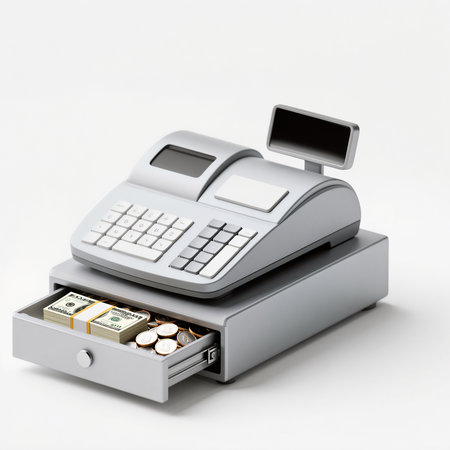A sleek cash register displays money and coins, showcasing a tidy workspace.の素材