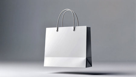 A sleek shopping bag hovers in mid-air, showing its modern design and neutral color.の素材