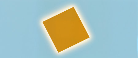A golden square hovers gently above a bright blue sky creating a calming effect.の素材