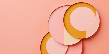 Circular forms in soft hues of pink and yellow create a pleasing aesthetic arrangement.の素材