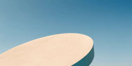 A circular blend structures art and nature against a clear blue sky.の素材