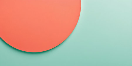 Bold coral circle meets a serene mint background, showing artistic simplicity.の素材