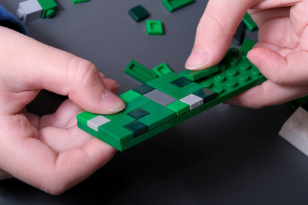 Crafting a detailed green creation with interlocking bricks brings joy and creativity.