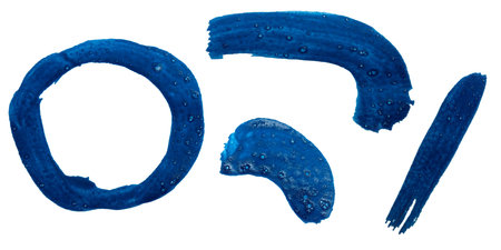 Bold blue paint strokes create unique shapes and textures on a surface.