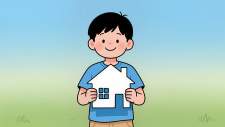 Young boy smiles brightly as he holds a simple paper house outdoors.の素材