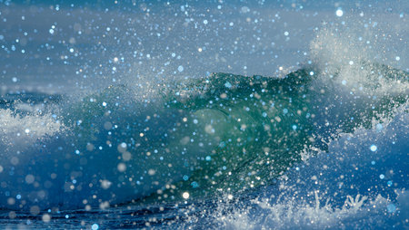 Crystal-clear waves capture sunlight, creating a dazzling display of water droplets.の素材