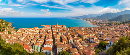 A panoramic scene capturing a picturesque village by the sea, featuring colorful homes.の素材