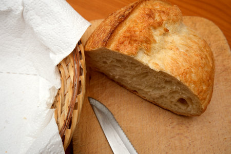 Soft, warm bread sits on a cutting board, ready to be served with delight.