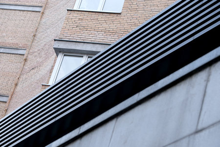 A close-up view of textured surfaces and shadows on a contemporary urban structure. Kyiv, Ukraine....