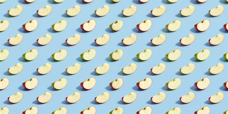 Brightly colored apple slices form a striking pattern over a blue backdrop.の素材