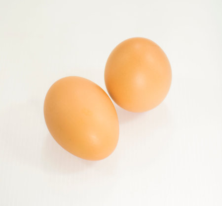 Two whole brown eggs.