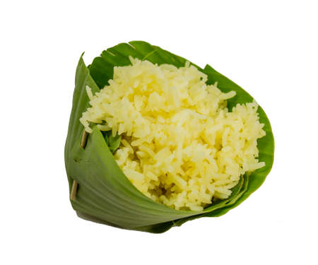 Thai yellow rice in count of banana leaf isolated on white background.の写真素材