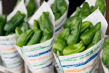 Fresh Padron peppers on cone exposed for saleの写真素材