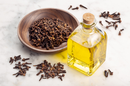 Clove essential oil. Clove oil glass bottle for skin care or acneの写真素材