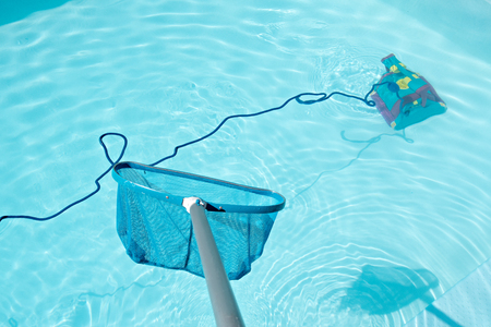 Pool Skimmer and underwater cleaning robot in swimming pool. Cleaning pool conceptの写真素材