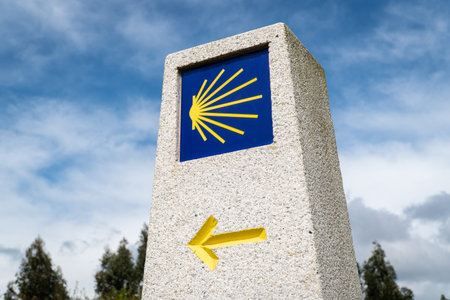 Milestone sign of Camino de Santiago. Pilgrimage sign to Santiago de Compostela