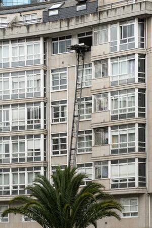 Relocation service on building. Lifting platform working on outdoor. Moving conceptの写真素材