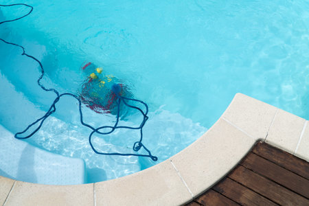 Robot cleaning swimming pool. Maintenance pool conceptの写真素材
