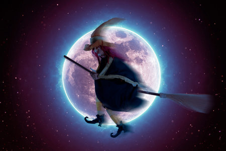Scary witch flying on a broomstick on the background of a full moon. Halloween backgroundの写真素材