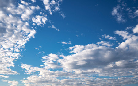 Blue sky with bright clouds background. Nature backdrop