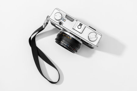 Flat lay film camera isolated on white background. Copy space. Photography or photographer concept