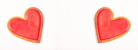 Valentine gift banner. Valentines day background with red heart shape cookie on wooden table. Copy spaceの写真素材