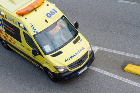 Santiago de Compostela, Spain; december 31, 2019: yellow moving ambulance seen from above. 061 Galicia, Spain. Galician health systemのeditorial素材