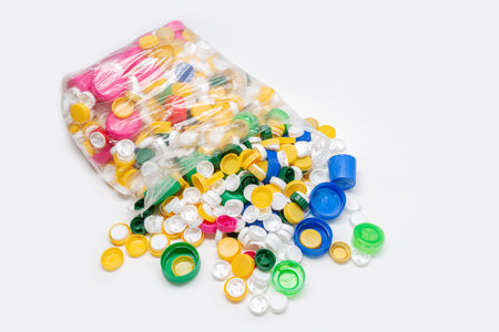 Bag full of plastic caps ready to be recycled. Recycling concept. Copy space