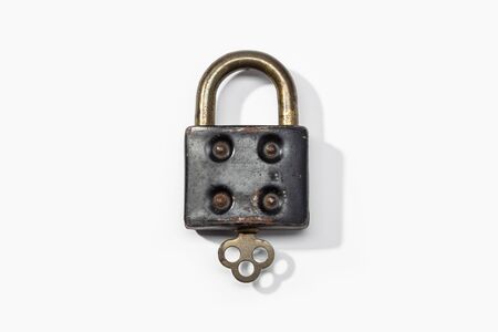 Antique padlock isolated on white background. Closed conceptの写真素材
