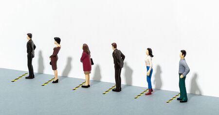 social distancing concept. Stay six feet or two meters apart. People waiting their turn in a row. Copy spaceの写真素材