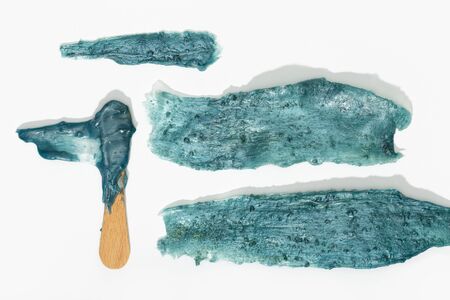 Hot wax depilation concept. Hot wax strip texture isolated on white background. Hair removal waxing conceptの写真素材