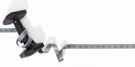 Dumbbells and measure tape on white background. Exercise banner background. Copy space