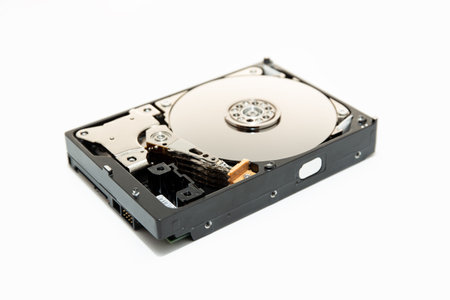 Opened Hard disk drive HDD isolated on white background. Computer hardware data storage.