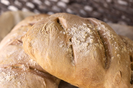 Homemade bread on rustic wooden background. Rustic bakery