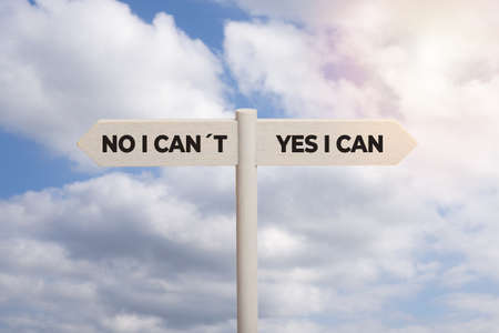 Yes I can concept. Wooden sign post with text isolated on sky backgroundの写真素材