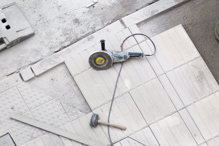 Construction tools on sidewalk under repair. Construction background