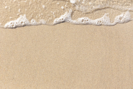 Beach Sand with sea foam waves