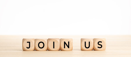 Join now word on wooden blocks on wood table. Copy space. White background