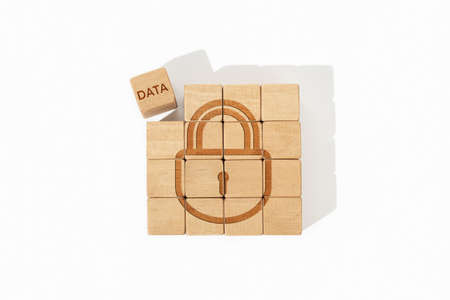 Data security concept. Wooden blocks with lock icon and data word isolated on white backgroundの写真素材