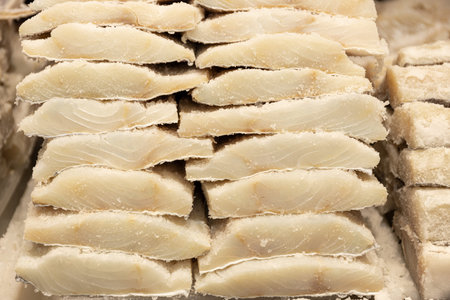Pile of Dried salted cod at fish shop. Typical spanish and portuguese food