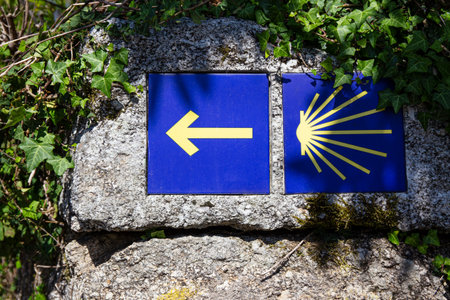 Camino de Santiago sign tiles on rock on outdoor. Way of St. James pilgrimage to Santiago de Compostelaの写真素材