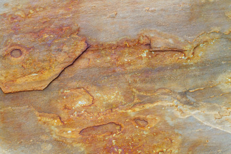Rough Natural stone background texture with rusty brown and gray tones